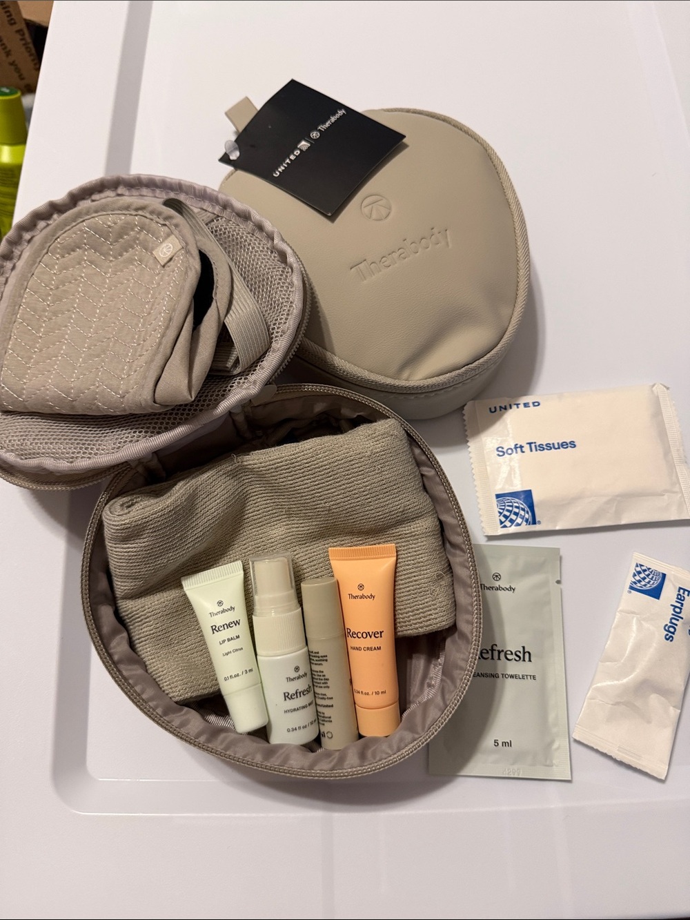 Therabody skincare travel sets (2). United Airlines Amenity Kits.